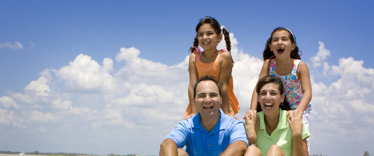 Family sitting on a beach in Florida