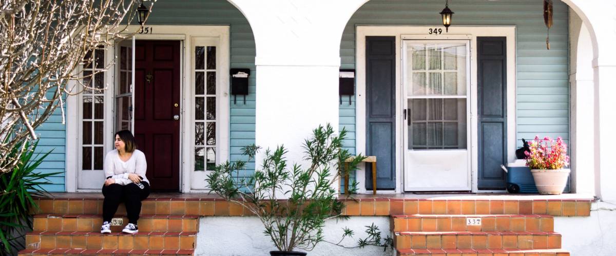 Person sitting on doorstep