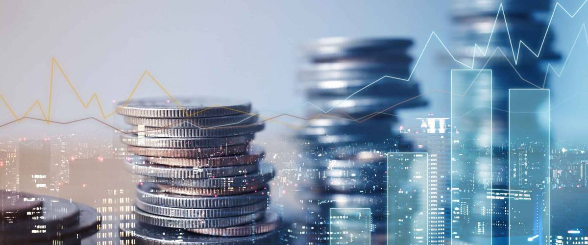 Double exposure of graph and rows of coins for finance and business concept