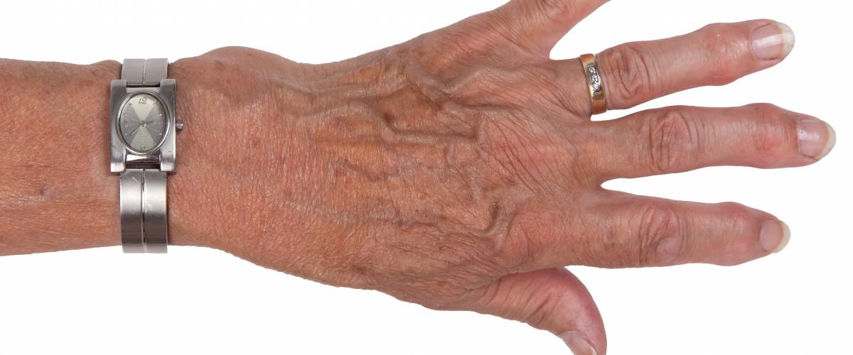 Hand of an old woman, close-up, isolated
