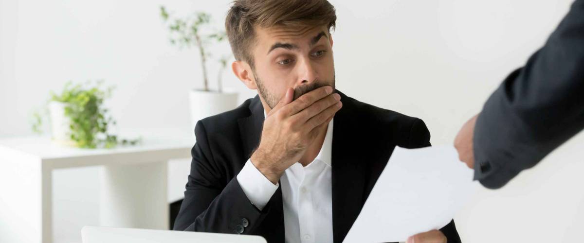 Surprised person receives scary document