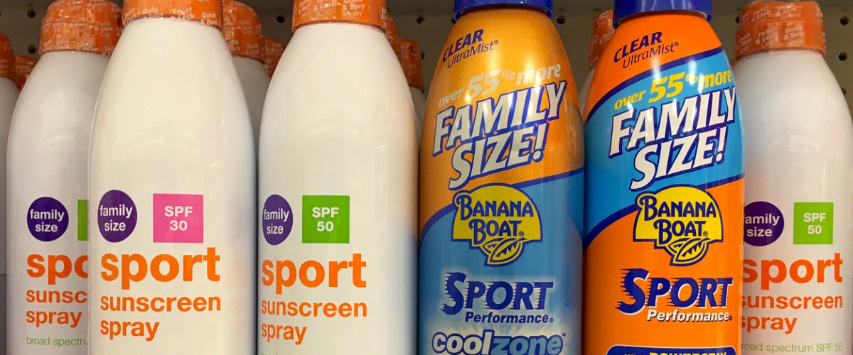 Grocery store shelf with generic brand sun screen SPF 30 and SPF 50 next to brand name sun screen SPF 30 and SPF 50