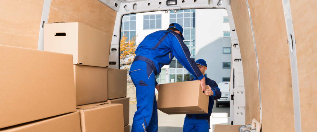 Young movers in van moving boxes