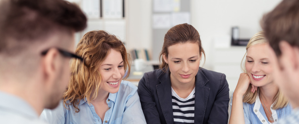 Five Young Office People Brainstorming for Ideas at the Table Inside the Boardroom