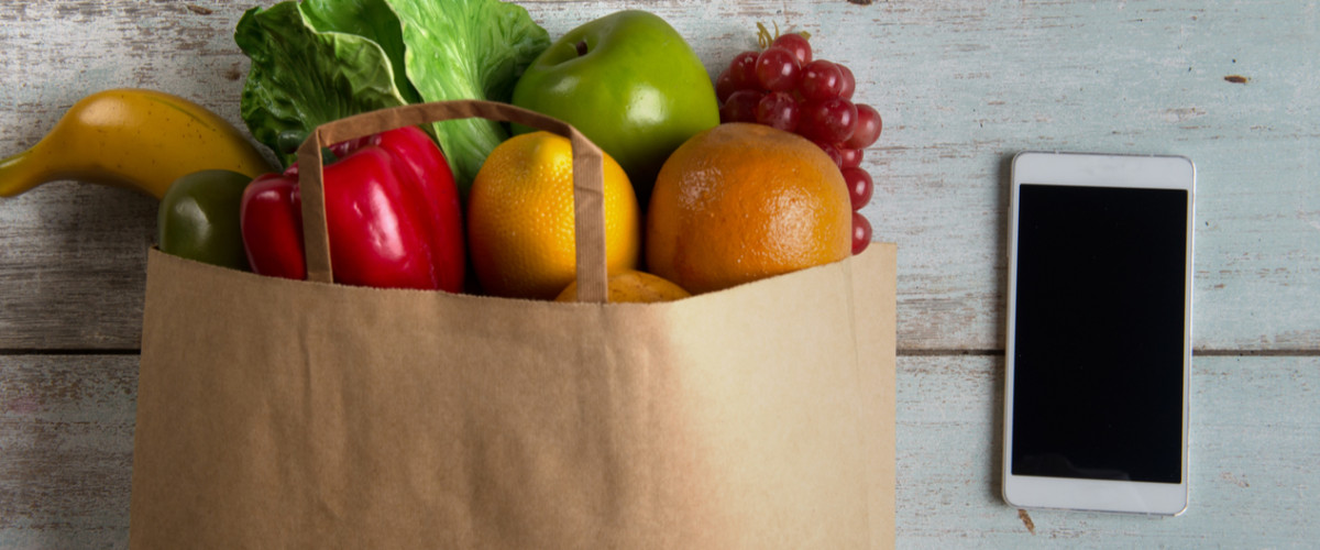 Groceries next to a smartphone