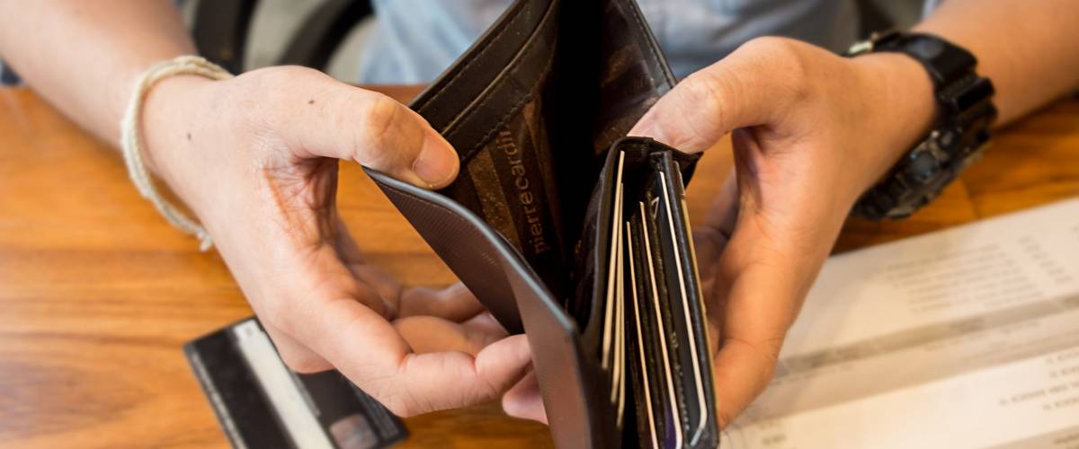 credit card debt - holding an empty wallet.