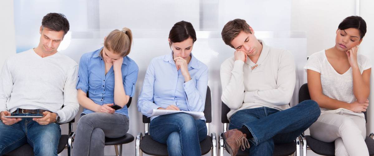 Young Group Of People Sleeping On Chair In A Waiting Room