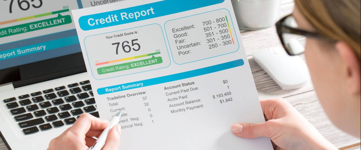 The woman checks the credit report and how many credit points.