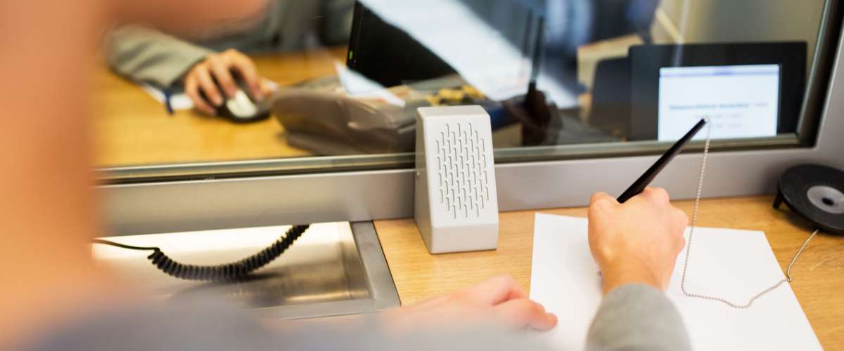 filling out an application in the bank