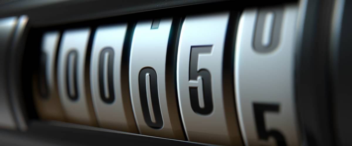A 3D render of an analogue car odometer concept showing a very low mileage
