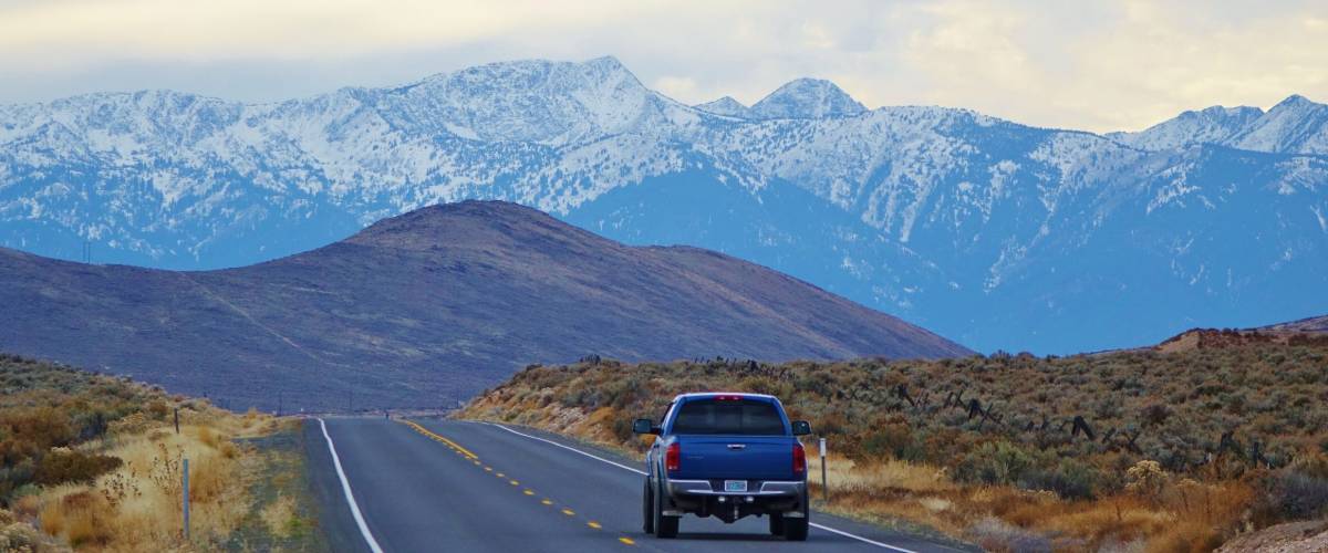 Hell's Canyon Scenic Byway. One car in the distance that's leaving Baker City, Oregon heading into the beautiful Wallowa Mountains on cold November day on State Route 86.