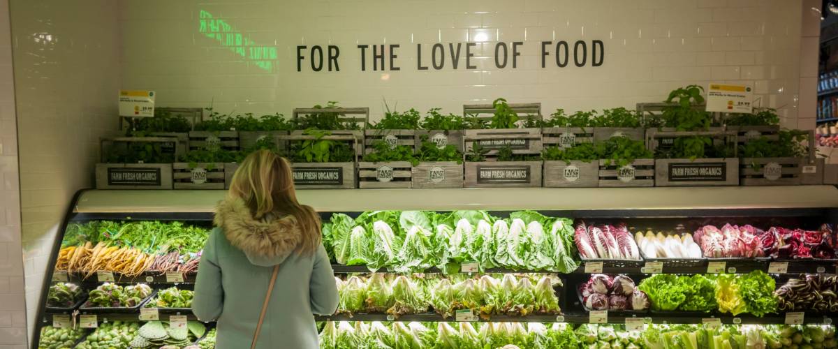 New York NY/USA-January 28, 2017 Shopper in the produce department in the new Whole Foods Market opposite Bryant Park in New York