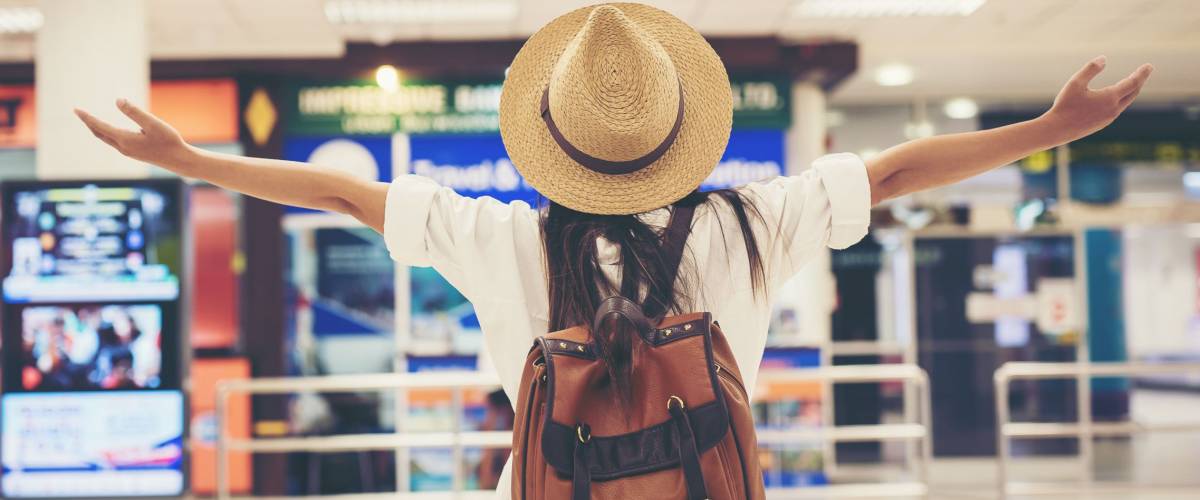 Happy woman tourist at the airport.Travel concept.