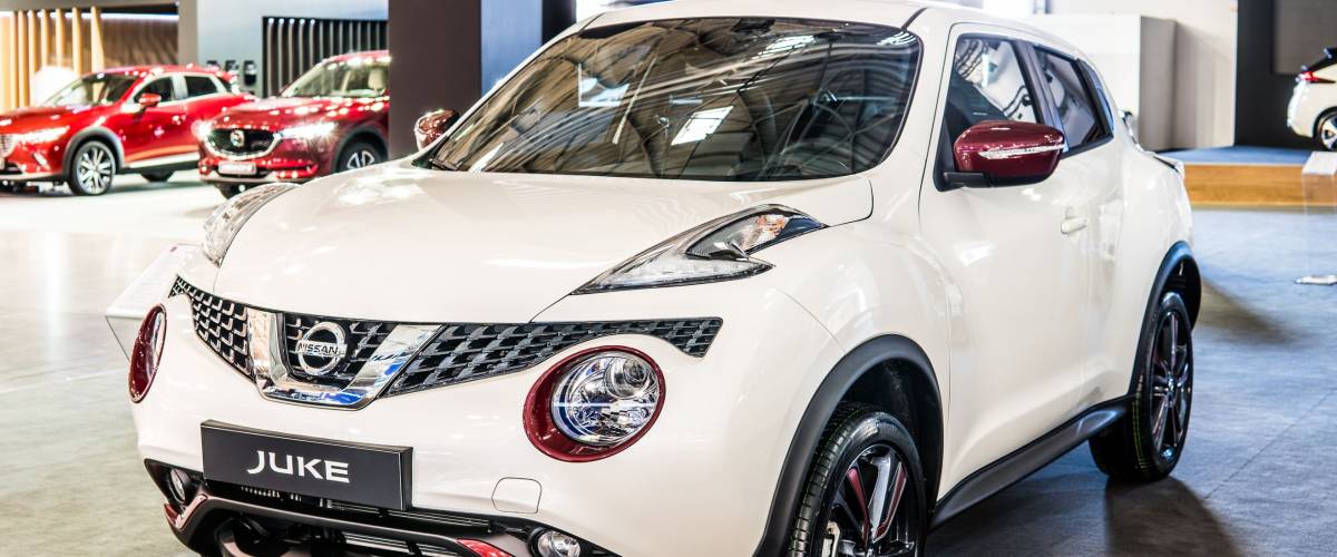 Poznan, Poland, April 05, 2018: metallic white red Nissan Juke at Poznan International Motor Show, compact crossover SUV produced by Japanese car manufacturer Nissan