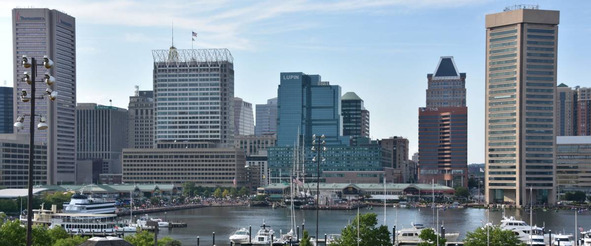 BALTIMORE, MARYLAND - JUL 2: View of Inner Harbor, from Federal Hill Park, in Baltimore, Maryland, as seen on July 2, 2017. The Harbor is a historic seaport, tourist attraction and landmark.