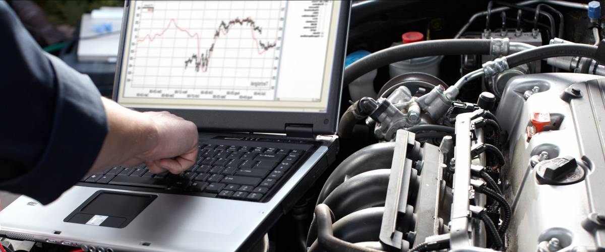 Professional car mechanic working in auto repair service.