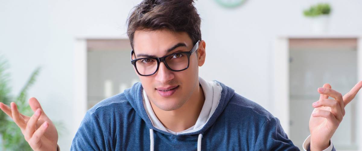 Young man mining bitcoins at home