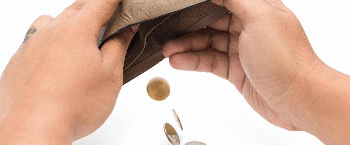 Human hand and empty wallet - broke