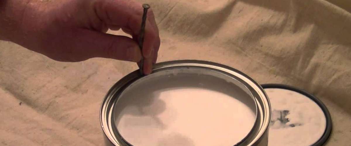 poking holes in the rim of paint can