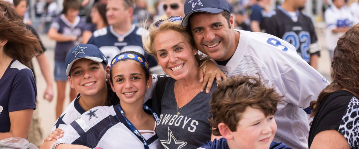 Arlington, TX, August 29 2015: Family of Dallas Cowboys fans outside of AT&T Stadium before the preseason Vikings vs Cowboys football game