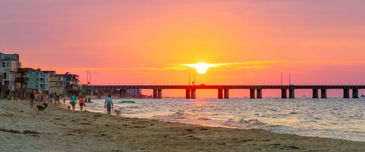 Sundown on the Chesapeake Bay with the Chesapeake Bay Bridge seen. Virginia Beach Side.