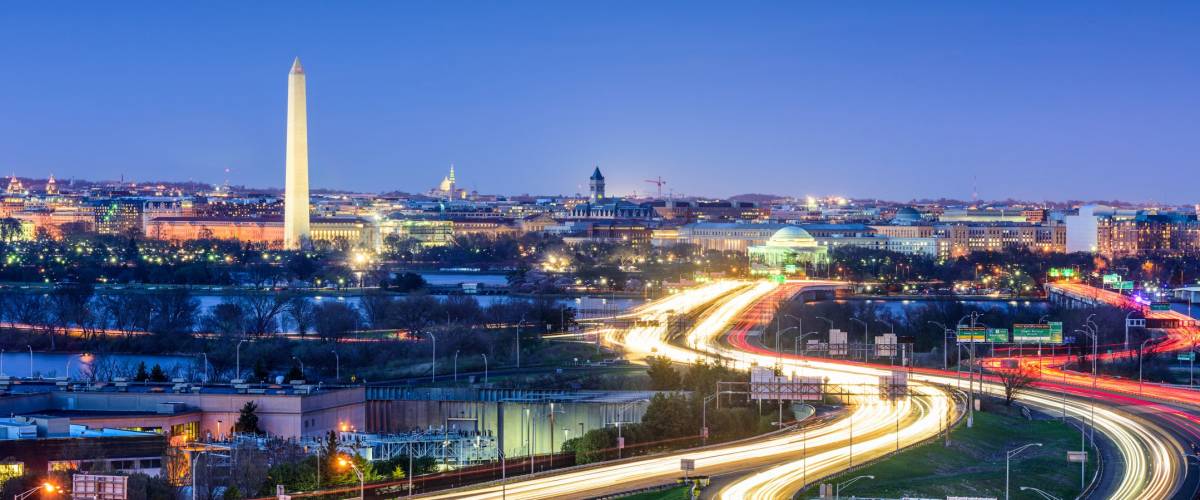 Washington, D.C. skyline with highways and monuments.