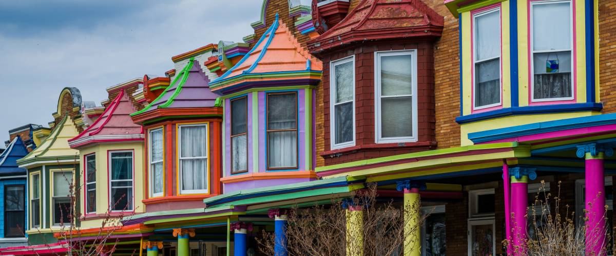 Colorful row houses along Guilford Avenue in Charles Village, Baltimore, Maryland.