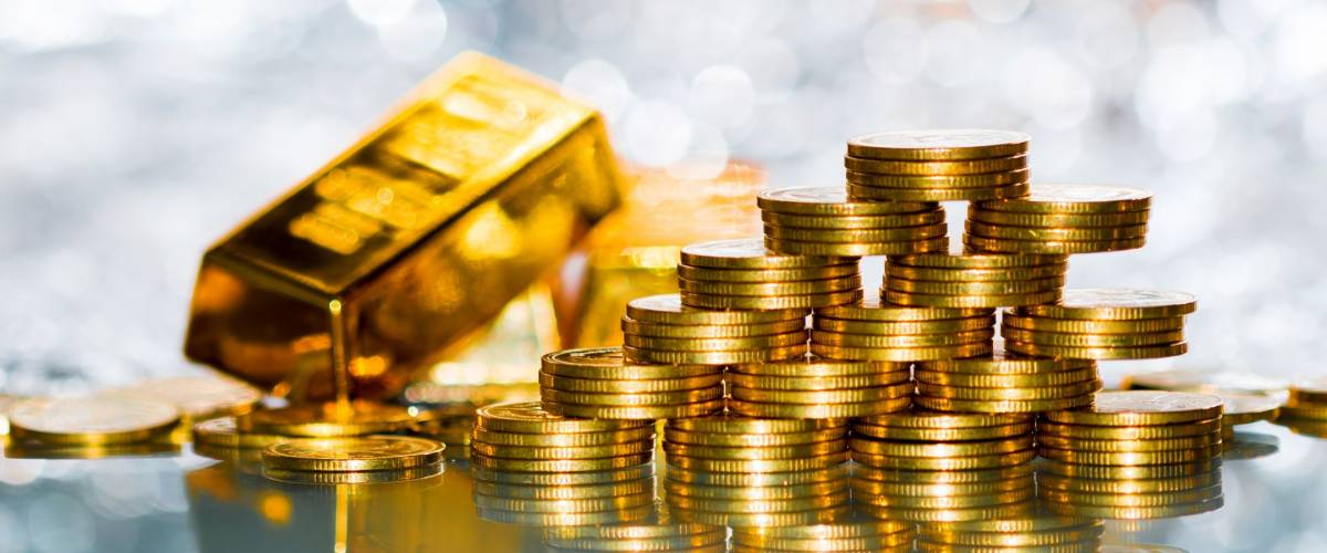Stacking gold coins with increase on the beautiful bokeh and gold bar background, Saving money and loan for prepare in the future.