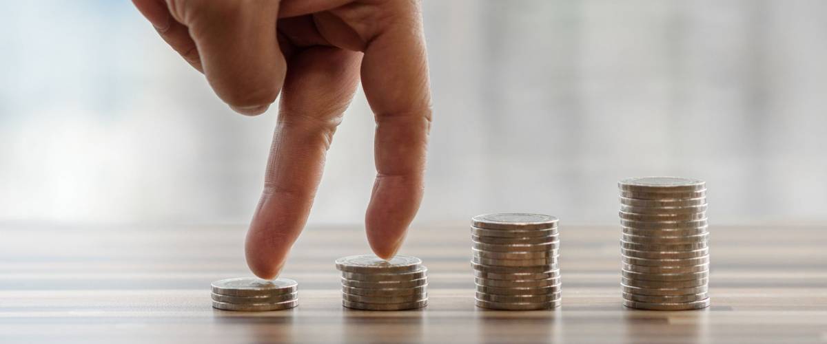 Hand with fingers business man putting on coin and looking for profit growth up, Collect money with earning bank deposit interest