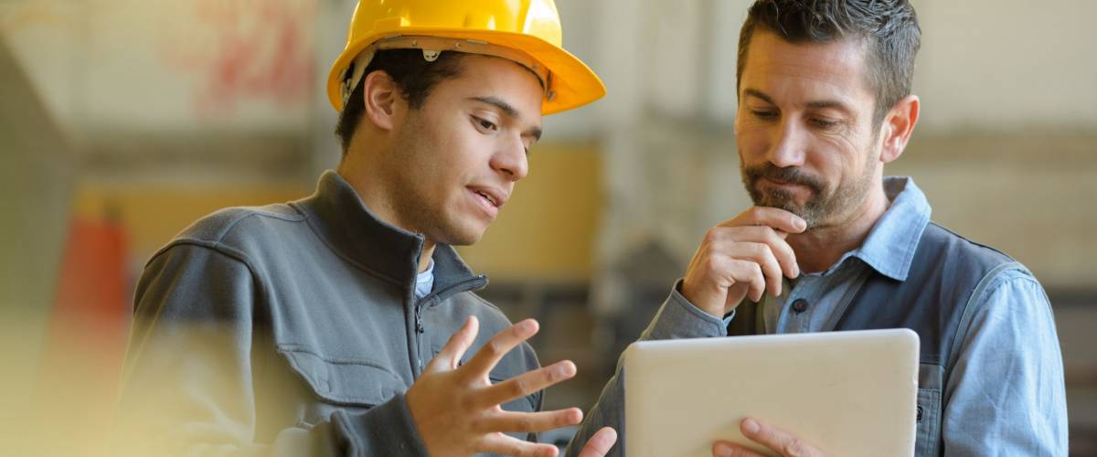 boss and worker checking results on the tablet