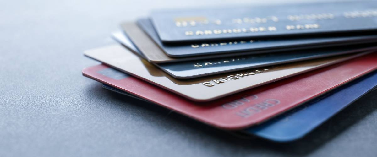 Pile of credit cards on table, closeup