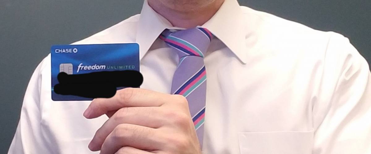 Mark Durrenberger, holding one of the cards he still uses, with the numbers blacked out.