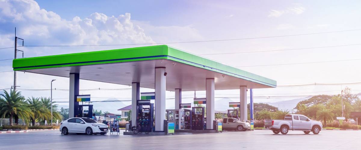 Gas fuel station with clouds and blue sky