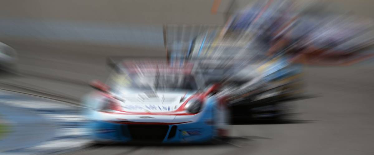 car racing on the road and track with motion blur and Radial blur