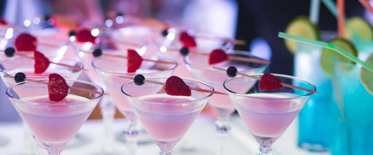 Beautiful row of signature cocktails at a wedding