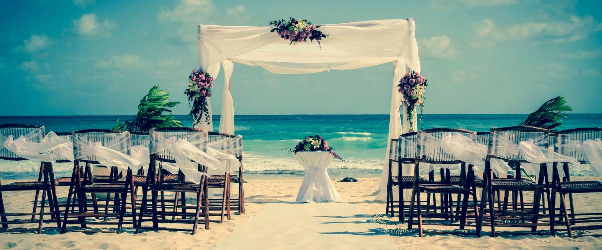 Wedding altar on the beach in Mexico with the ocean in the background