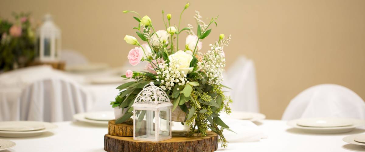 Table set at a luxury wedding reception event party. Table centerpieces