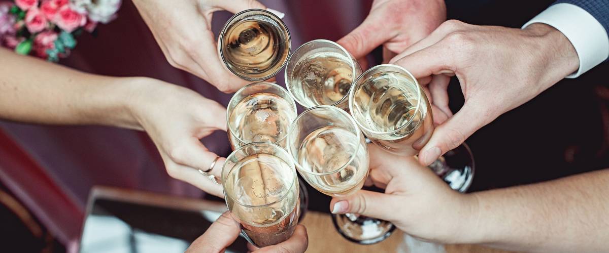 Toasting at a wedding with sparkling wine