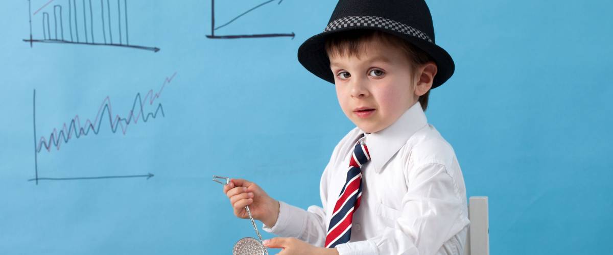Young boy, counting money and taking notes