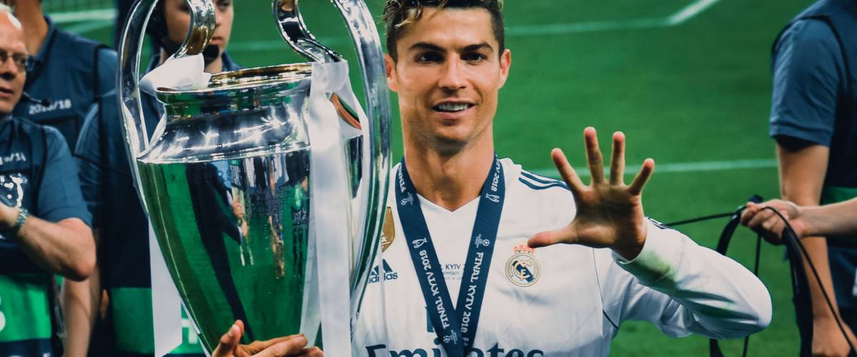 KYIV, UKRAINE - MAY 26, 2018: Cristiano Ronaldo shows on the fingers of his hand five won Champions League cups in Kiev, Ukraine