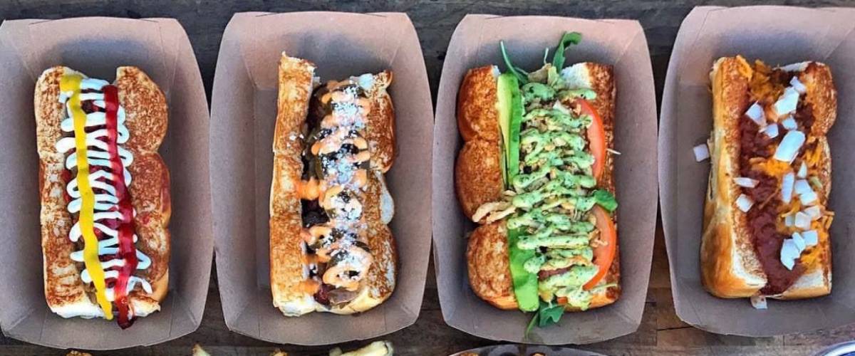 Loaded-up hot dogs prepared at the Dog Haus location in Menifee, California