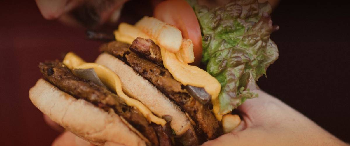 Eating a plant-based burger from Next Level Burger