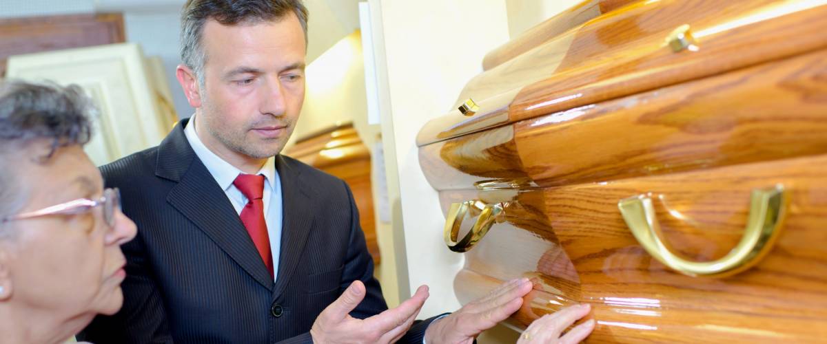 Elderly lady choosing coffin