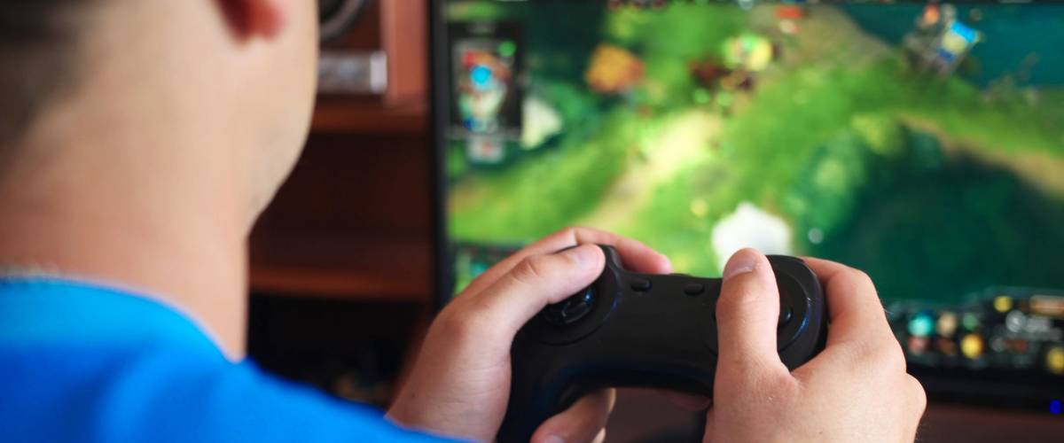 Man hand playing a computer games