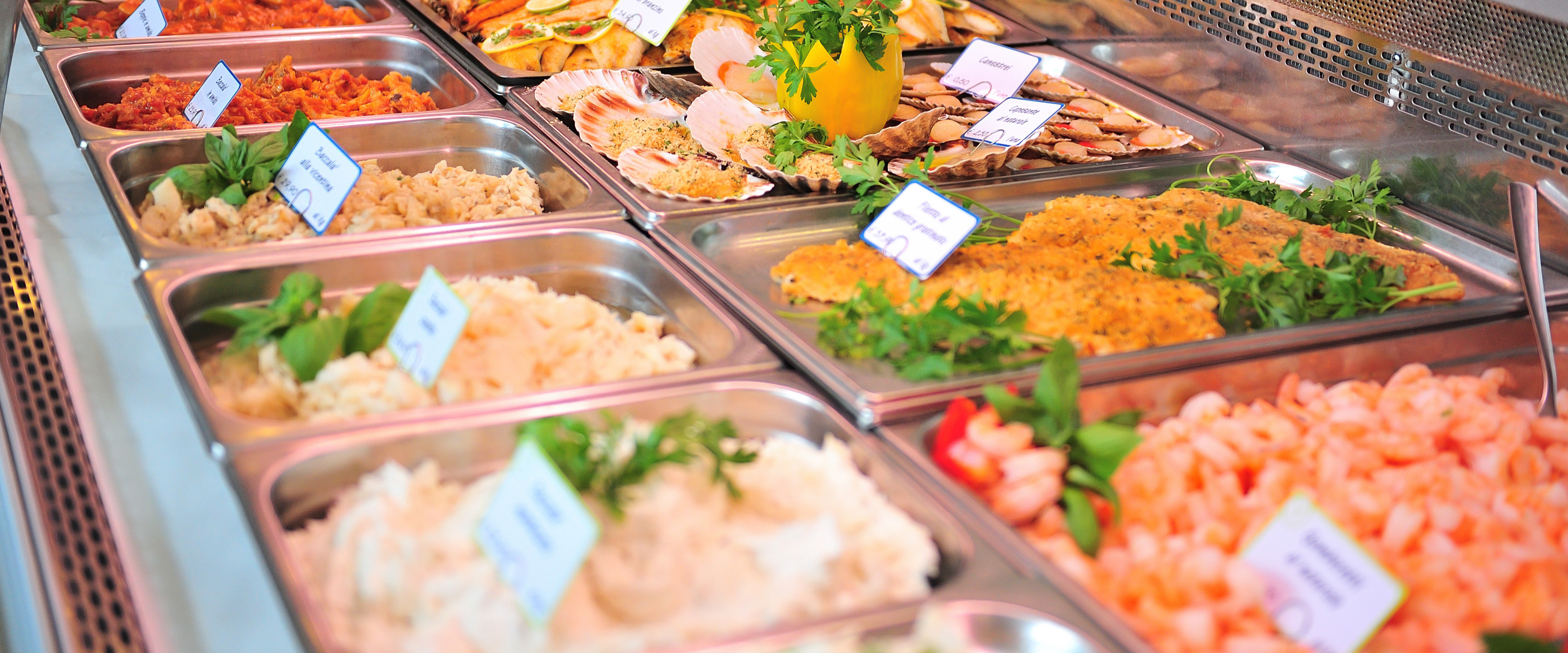 Expensive prepared foods in a lunch counter at a grocery store