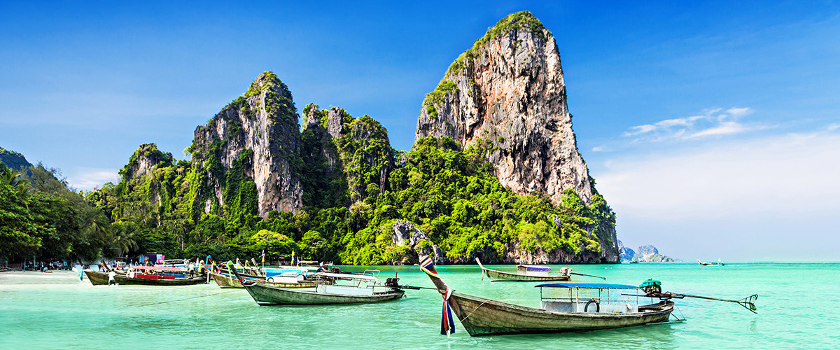 Longtail boats at a beautiful beach in Thailand