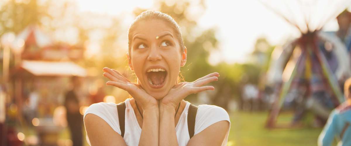 young woman in a good mood at a fair