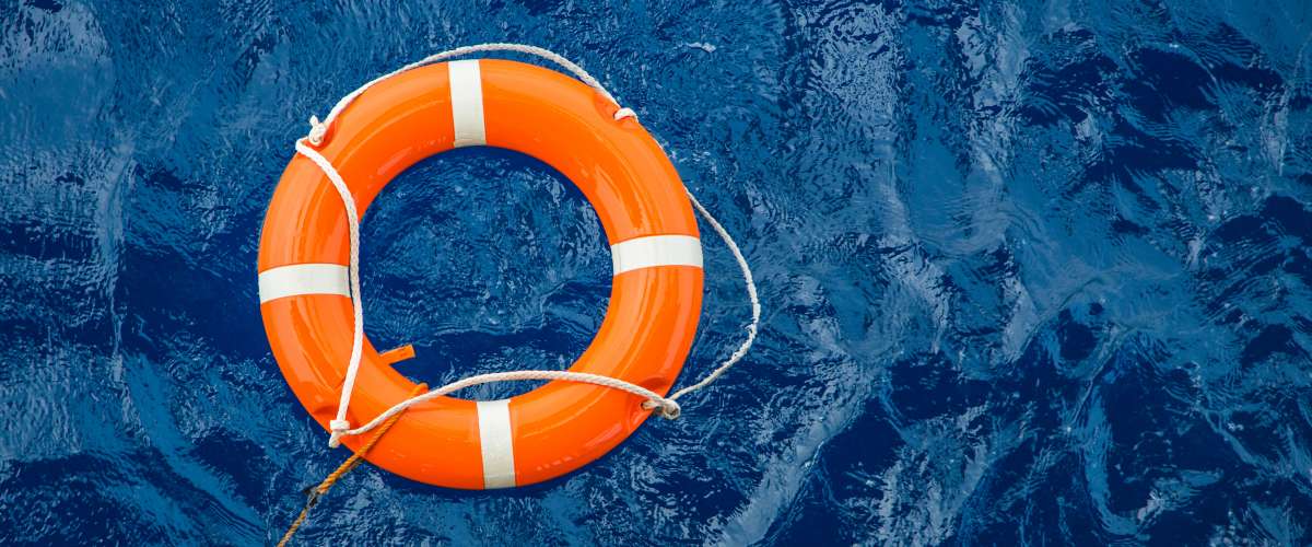 Life buoy preserver floating in water