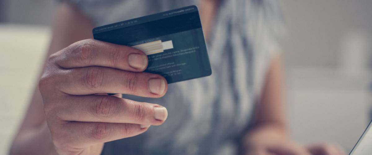 Close up of woman hand using credit card.