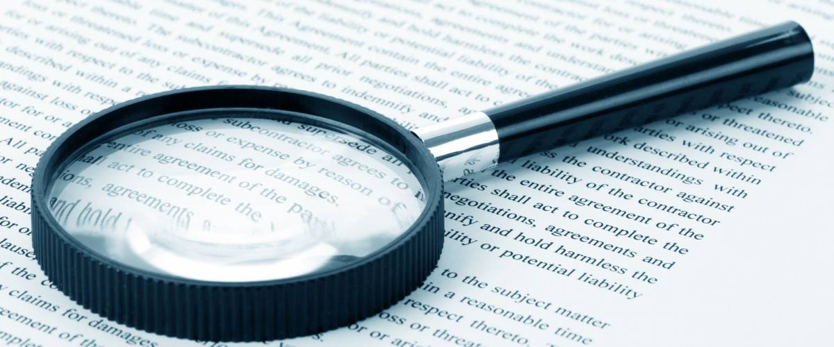 Magnifying Glass and document close up